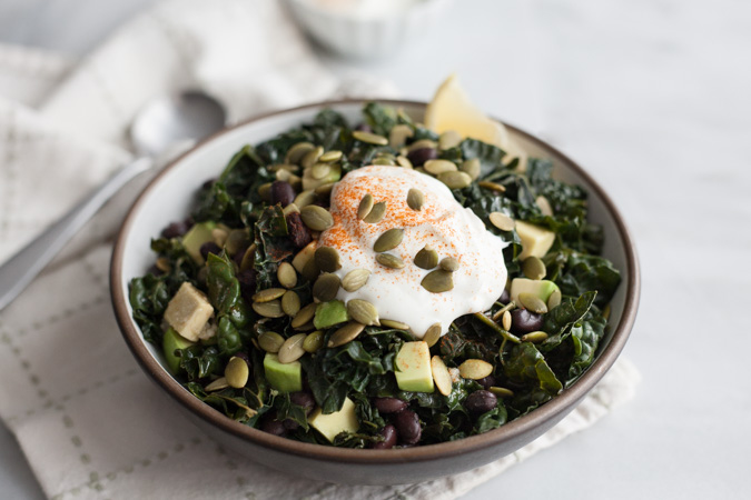 Greens and Black Beans | BourbonandHoney.com -- This big bowl of Greens and Black Beans is hearty, fresh and nourishing. Serve it for a light lunch or stuffed it in a tortilla with roasted veggies.