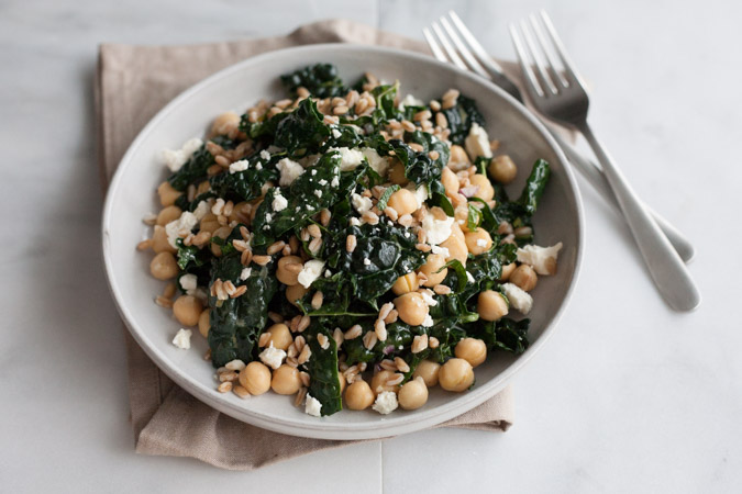 Kale and Farro Salad with Chickpeas | BourbonandHoney.com -- Fresh, hearty and delicious, this Kale and Farro Salad is packed with kale, a light lemon dressing and a sprinkling of feta cheese.