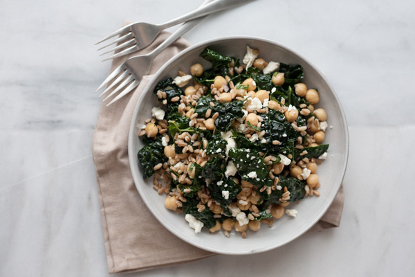 Kale and Farro Salad with Chickpeas | BourbonandHoney.com -- Fresh, hearty and delicious, this Kale and Farro Salad is packed with kale, a light lemon dressing and a sprinkling of feta cheese.