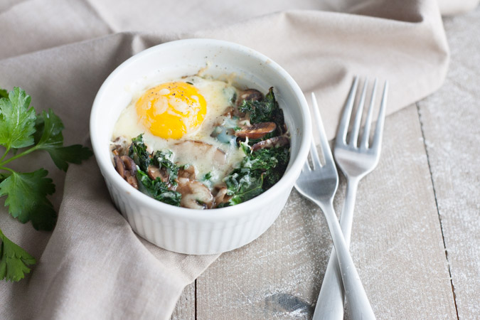 Baked Eggs with Kale and Mushrooms | BourbonandHoney.com -- These creamy, indulgent Baked Eggs with Kale and Mushrooms are perfect for a lazy weekend breakfast. 