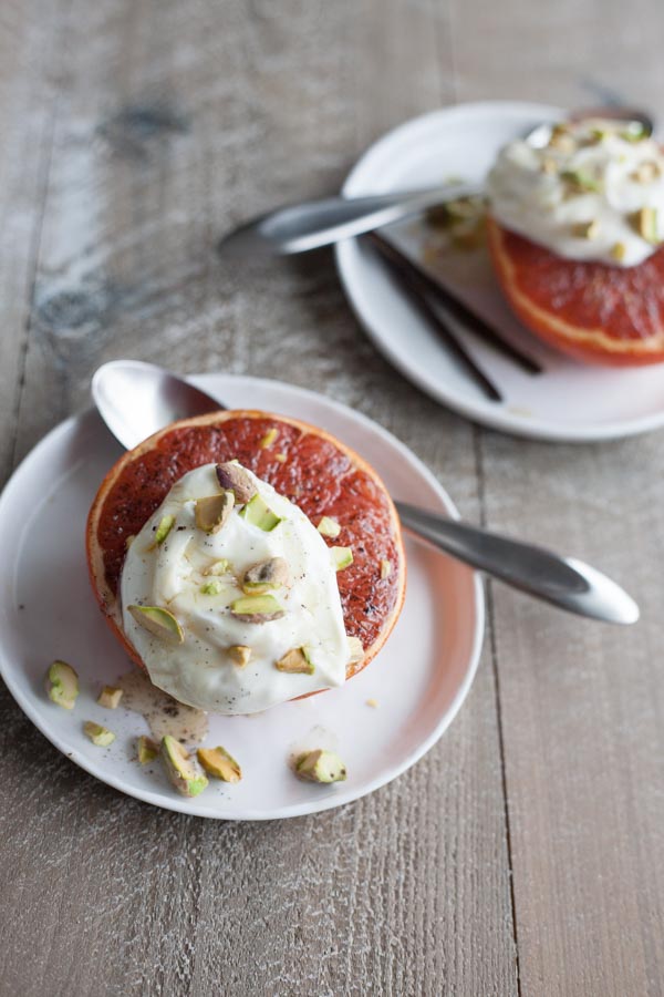 Broiled Grapefruit with Honey Yogurt and Pistachios | BourbonandHoney.com -- Fresh, citrusy and caramelized, this Broiled Grapefruit with Honey Yogurt is a delicious breakfast, snack or sweet treat.