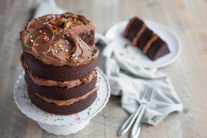 Chocolate Birthday Cake | BourbonandHoney.com -- Tall, dark, chocolatey and delicious this chocolate birthday cake is impressive and the perfect way to celebrate!