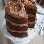 Chocolate Birthday Cake | BourbonandHoney.com -- Tall, dark, chocolatey and delicious this chocolate birthday cake is impressive and the perfect way to celebrate!