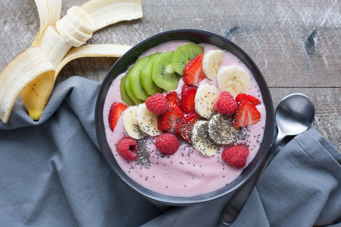 Strawberry Banana Smoothie Bowl | BourbonandHoney.com -- Simple, delicious and packed with fruit, this Strawberry Banana Smoothie Bowl is a great breakfast on the go!