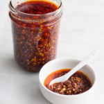 Crunchy Chile Sauce | BourbonandHoney.com -- This hot sauce is savory, spicy and totally delicious. Spoon it on everything from rice bowls to scrambled eggs, roasted veggies or nachos.