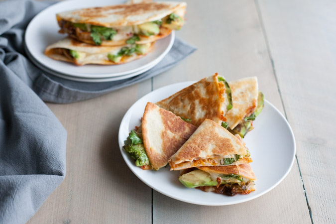 Kimchi Quesadilla | BourbonandHoney.com -- These over-the-top cheesy Kimchi Quesadillas are a deliciously greasy and spicy snack or cocktail party appetizer.