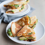 Kimchi Quesadilla | BourbonandHoney.com -- These over-the-top cheesy Kimchi Quesadillas are a deliciously greasy and spicy snack or cocktail party appetizer.