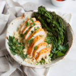 Roasted Harissa Chicken with Broccolini and Couscous | BourbonandHoney.com -- This Spicy Roasted Harissa Chicken is a super easy sheet pan supper, it's paired with broccolini and couscous and ready in about 30 minutes!