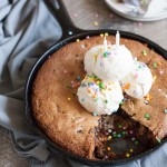 Bourbon and Honey Brown Butter Chocolate Chunk Skillet Cookie | BourbonandHoney.com -- This over-the-top Brown Butter Chocolate Chunk Skillet Cookie is spiked with Bourbon and Honey and perfect for celebrating!