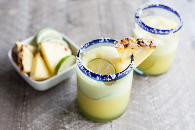 Frozen Pineapple Margaritas | BourbonandHoney.com -- Sweet, frosty and totally refreshing, these tequila spiked frozen pineapple margaritas are going to sweeten your weekend!