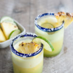 Frozen Pineapple Margaritas | BourbonandHoney.com -- Sweet, frosty and totally refreshing, these tequila spiked frozen pineapple margaritas are going to sweeten your weekend!