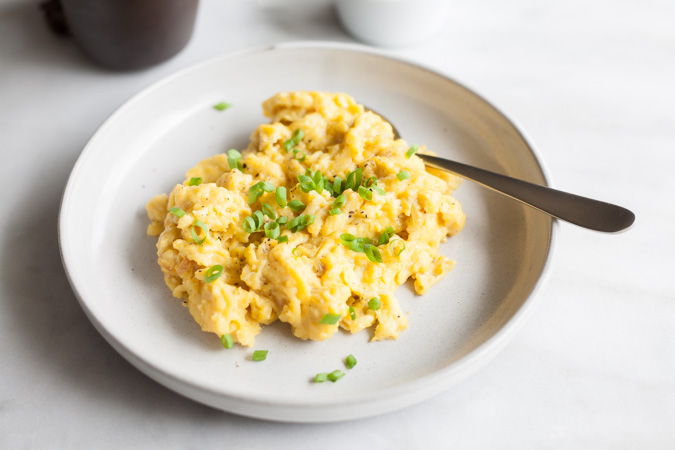 Perfect Scrambled Eggs | BourbonandHoney.com -- Breakfast or brunch is incomplete without the Perfect Scrambled Eggs to please a crowd. They're light, fluffy and delicious!