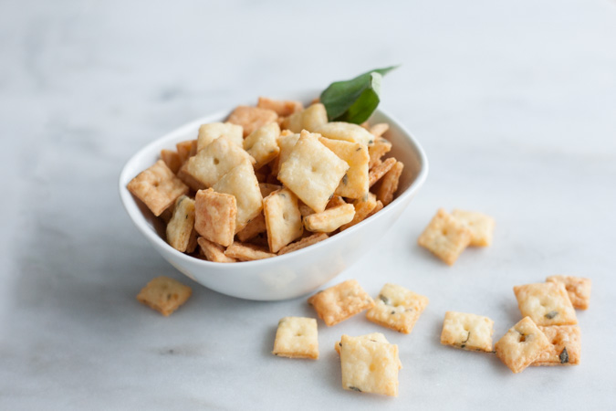 Sage and Fontina Crackers | BourbonandHoney.com --These crunchy cheesy Sage and Fontina Crackers are totally addicting. They're slightly herby, super cheesy and totally worth making!