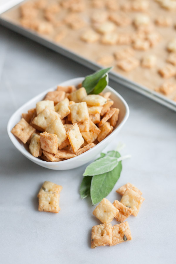 Sage and Fontina Crackers | BourbonandHoney.com -- These crunchy cheesy Sage and Fontina Crackers are totally addicting. They're slightly herby, super cheesy and totally worth making!