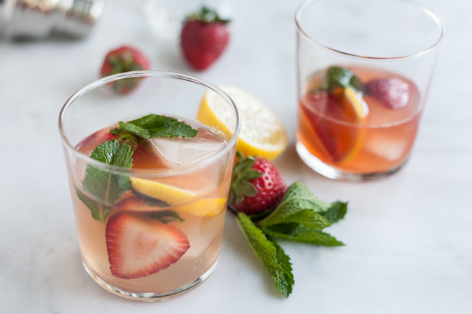 Bourbon and Honey Strawberry Smash Cocktail | BourbonandHoney.com -- This Bourbon and Honey spiked Strawberry Smash Cocktail is simple, fruity, refreshing and delicious! A great cocktail choice for a summer patio!