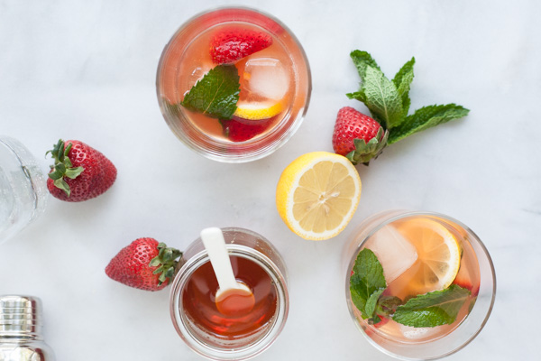 Bourbon and Honey Strawberry Smash Cocktail | BourbonandHoney.com -- This Bourbon and Honey spiked Strawberry Smash Cocktail is simple, fruity, refreshing and delicious! A great cocktail choice for a summer patio!