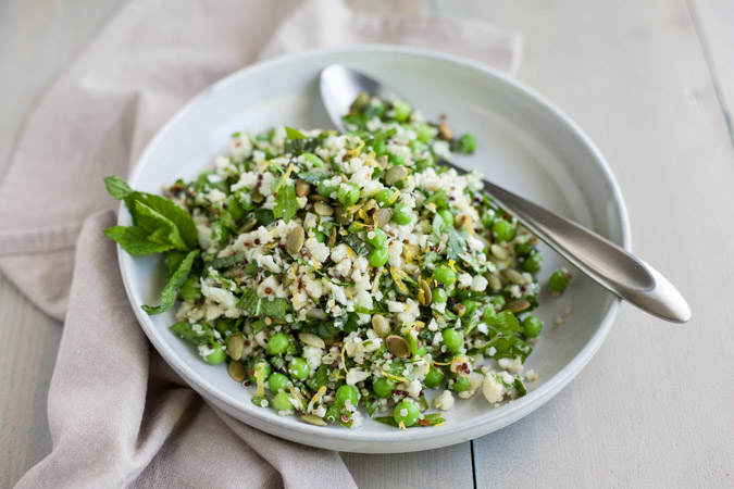 Quinoa Cauliflower Tabbouleh Salad | BourbonandHoney.com -- This Cauliflower Tabbouleh Salad is a fresh spring dish of cauliflower and quinoa paired with herbs, fresh peas, lemon and toasted pepitas.