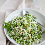 Quinoa Cauliflower Tabbouleh Salad | BourbonandHoney.com -- This Cauliflower Tabbouleh Salad is a fresh spring dish of cauliflower and quinoa paired with herbs, fresh peas, lemon and toasted pepitas.