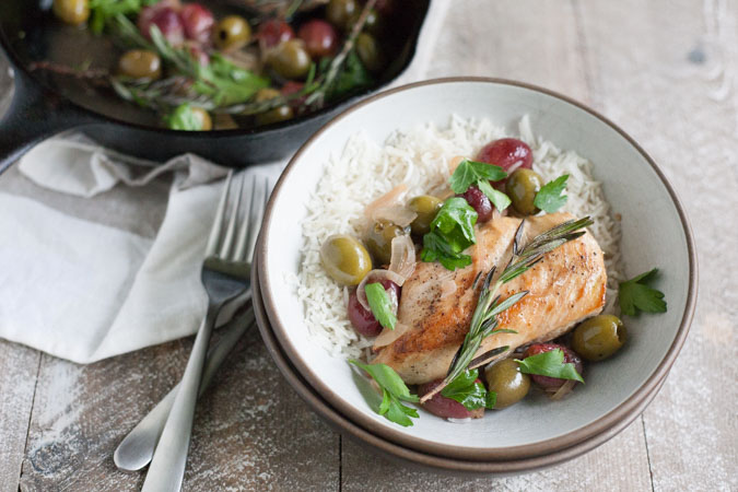 Skillet Chicken with Olives and Rosemary | BourbonandHoney.com -- This flavorful and delicious Skillet Chicken with Olives and Rosemary is an impressive dinner recipe for guests and an easy weeknight meal!