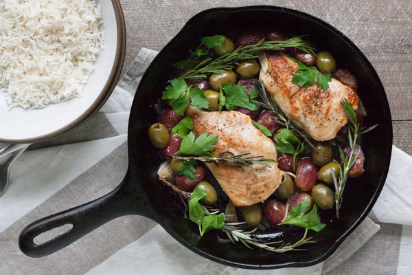 Skillet Chicken with Olives and Rosemary | BourbonandHoney.com -- This flavorful and delicious Skillet Chicken with Olives and Rosemary is an impressive dinner recipe for guests and an easy weeknight meal!