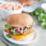 Korean Fried Chicken Sandwich | BourbonandHoney.com -- This Korean Fried Chicken Sandwich is spicy, flavorful and delicious. Topped with a kimchi slaw and gochujang aioli, it's irresistible!