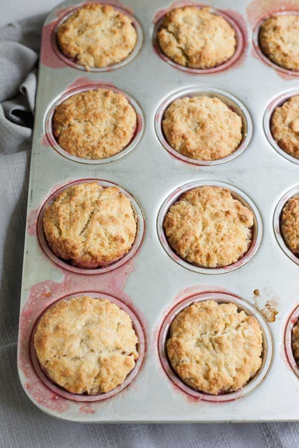 Rhubarb Upside-Down Cupcakes | BourbonandHoney.com --Tangy, tender and slightly sweet, these Rhubarb Upside-Down Cupcakes are an easy and tasty summer treat topped with ice cream!
