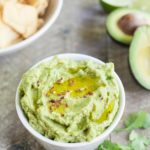 Spicy Avocado Hummus | BourbonandHoney.com -- Rich, creamy and garlicky, this avocado hummus is packed with chickpeas, tahini, a squeeze of lime juice and just the right amount of spice.