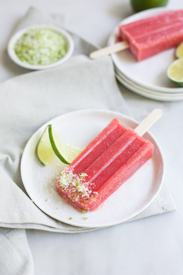 Strawberry Margarita Frozen Pops | BourbonandHoney.com -- These tequila spiked Strawberry Margarita Frozen Pops will be your new go-to summer treat. They're boozy, fruity and perfectly frosty on a hot day!