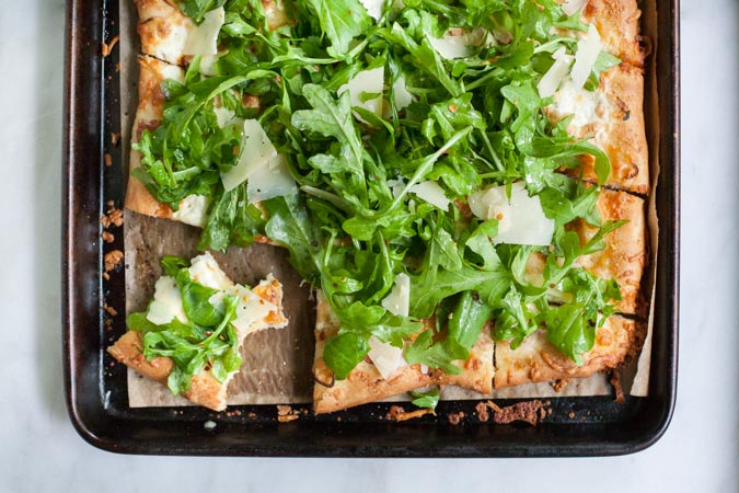 Burrata, Prosciutto and Arugula Pizza | BourbonandHoney.com -- Crispy, crunchy, fresh and perfectly cheesy, this Burrata, Prosciutto and Arugula Pizza will be your new family favorite pizza recipe!