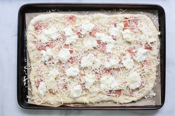 Burrata, Prosciutto and Arugula Pizza | BourbonandHoney.com -- Crispy, crunchy, fresh and perfectly cheesy, this Burrata, Prosciutto and Arugula Pizza will be your new family favorite pizza recipe! 