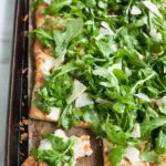 Burrata, Prosciutto and Arugula Pizza | BourbonandHoney.com -- Crispy, crunchy, fresh and perfectly cheesy, this Burrata, Prosciutto and Arugula Pizza will be your new family favorite pizza recipe!