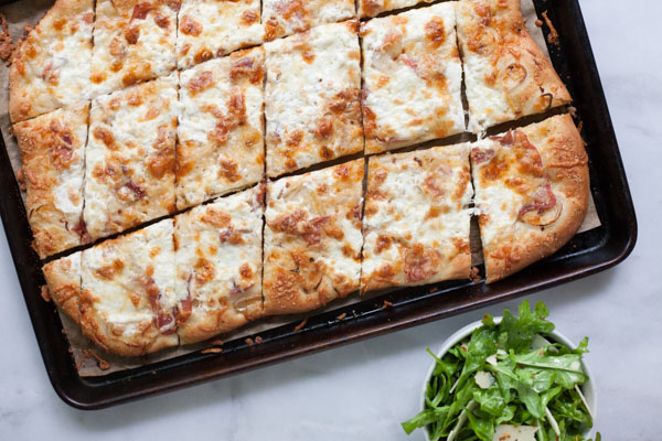 Burrata, Prosciutto and Arugula Pizza | BourbonandHoney.com -- Crispy, crunchy, fresh and perfectly cheesy, this Burrata, Prosciutto and Arugula Pizza will be your new family favorite pizza recipe!