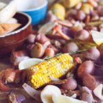 Easy Shrimp Boil | BourbonandHoney.com -- This quick and Easy Shrimp Boil is a flavorful one-pot meal fit for a crowd! It's packed with potatoes, corn, shrimp and sausage.