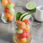 Bourbon and Honey Melon Balls | BourbonandHoney.com -- Boozy, frosty and super refreshing these Bourbon and Honey Melon Balls with fresh mint and lime are the perfect summer happy hour snack.