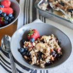 Coconut Baked Oatmeal with Berries | BourbonandHoney.com -- A warm, fruity and hearty Coconut Baked Oatmeal with Berries, almonds and bananas. It's the perfect recipe for a lazy weekend brunch!