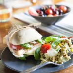 Picnic Perfect Caprese Chicken Sandwich | BourbonandHoney.com -- Seasoned chicken, pesto aioli, summery tomatoes, fresh basil and lots of cheese make these Caprese Chicken Sandwiches quick, delicious and picnic ready!