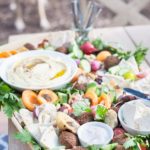 Ultimate Mediterranean Hummus Platter | BourbonandHoney.com -- This Mediterranean Hummus platter is the ultimate party appetizer. No need to make anything from scratch, just throw together your favorite ingredients for a seriously simple yet impressive snack.