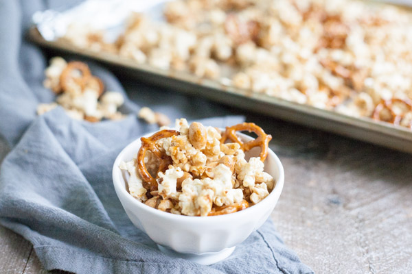 Bourbon and Honey Caramel Corn | BourbonandHoney.com -- Salty pretzels and crunchy nuts make this Bourbon and Honey Caramel Corn perfectly sweet and salty for a delicious food gift of tasty snack!