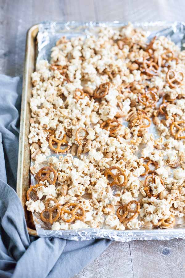 Bourbon and Honey Caramel Corn | BourbonandHoney.com -- Salty pretzels and crunchy nuts make this Bourbon and Honey Caramel Corn perfectly sweet and salty for a delicious food gift of tasty snack!