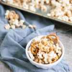 Bourbon and Honey Caramel Corn | BourbonandHoney.com -- Salty pretzels and crunchy nuts make this Bourbon and Honey Caramel Corn perfectly sweet and salty for a delicious food gift of tasty snack!