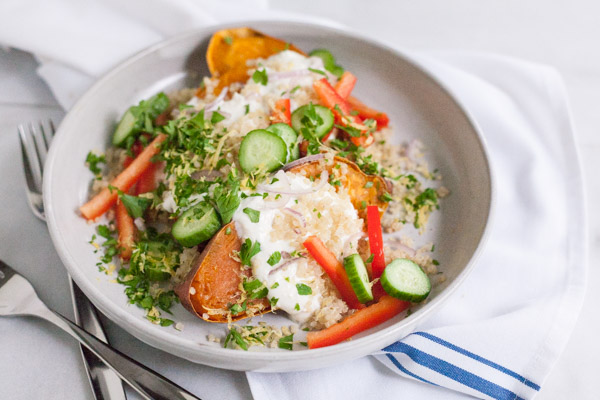 Greek Baked Sweet Potatoes | BourbonandHoney.com -- These simple Greek Baked Sweet Potatoes are a hearty, healthy and flavorful weeknight recipe or a great brown bag lunch.