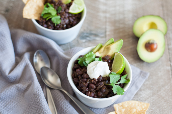 Spicy Slow Cooker Black Beans | BourbonandHoney.com -- This Spicy Slow Cooker Black Bean recipe is quick, flavorful and super easy to customize. Serve it with rice, tortilla chips and all your favorite toppers.