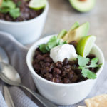 Spicy Slow Cooker Black Beans | BourbonandHoney.com -- This Spicy Slow Cooker Black Bean recipe is quick, flavorful and super easy to customize. Serve it with rice, tortilla chips and all your favorite toppers.
