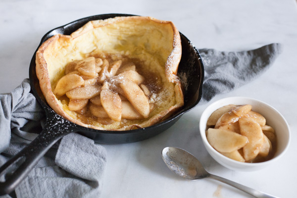Apple Cinnamon Oven Pancake | BourbonandHoney.com -- Light and airy, this puffy Apple Cinnamon Oven Pancake is the perfect breakfast recipe, for your favorite fall apples or fresh fruit!