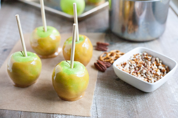 Bourbon and Honey Caramel Apples | BourbonandHoney.com -- Sweet, spiked and perfect for a chilly fall, these Bourbon and Honey Caramel Apples are a great homemade sweet treat or snack!