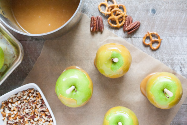 Bourbon and Honey Caramel Apples | BourbonandHoney.com -- Sweet, spiked and perfect for a chilly fall, these Bourbon and Honey Caramel Apples are a great homemade sweet treat or snack!
