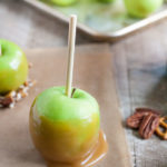 Bourbon and Honey Caramel Apples | BourbonandHoney.com -- Sweet, spiked and perfect for a chilly fall, these Bourbon and Honey Caramel Apples are a great homemade sweet treat or snack!