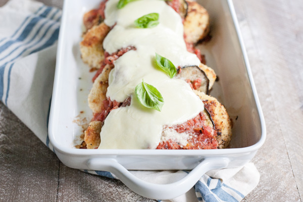 Eggplant Chicken Parmesan | BourbonandHoney.com -- Cheesy, delicious and in the oven in just 30 minutes, this Eggplant Chicken Parmesan dish is the best way to enjoy two of your favorite recipes.