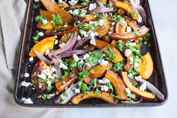 Spicy Roasted Pumpkin with Honey and Feta | BourbonandHoney.com -- This Spicy Roasted Pumpkin recipe is a quick and easy gluten free side dish with sweet caramelized honey, feta cheese and pumpkin seeds.