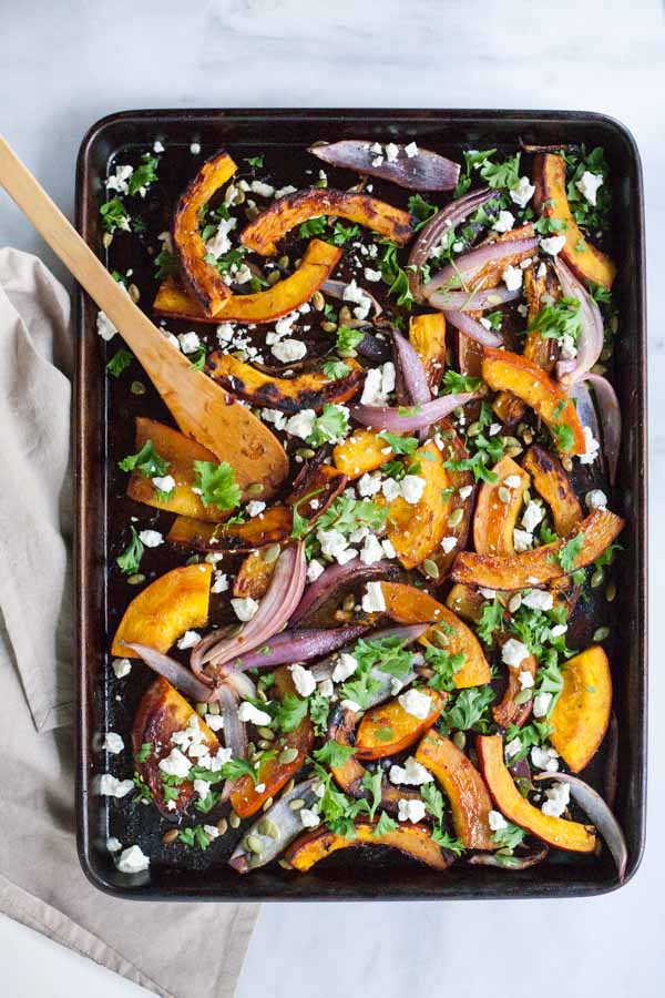 Spicy Roasted Pumpkin with Honey and Feta | BourbonandHoney.com -- This Spicy Roasted Pumpkin recipe is a quick and easy gluten free side dish with sweet caramelized honey, feta cheese and pumpkin seeds.